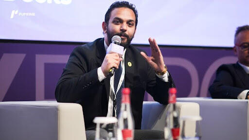 Mr Ahmed Yousre presenting his keynote speech at iFX Expo Dubai 2026 on AI strategies